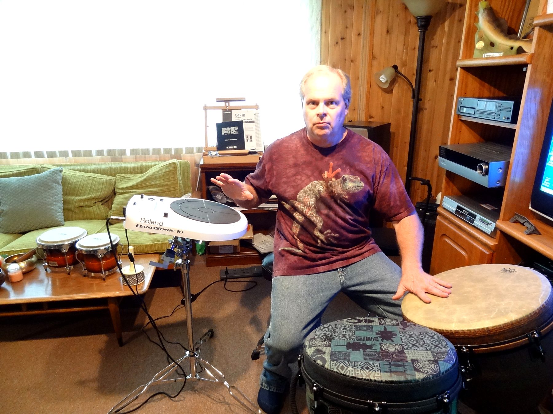 Joliet Jeff playing hand drums beside a Roland HandSonic